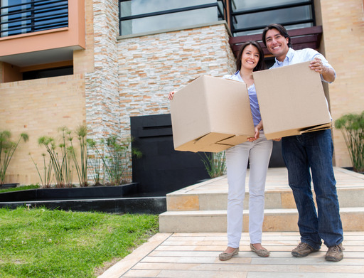 Happy couple moving house